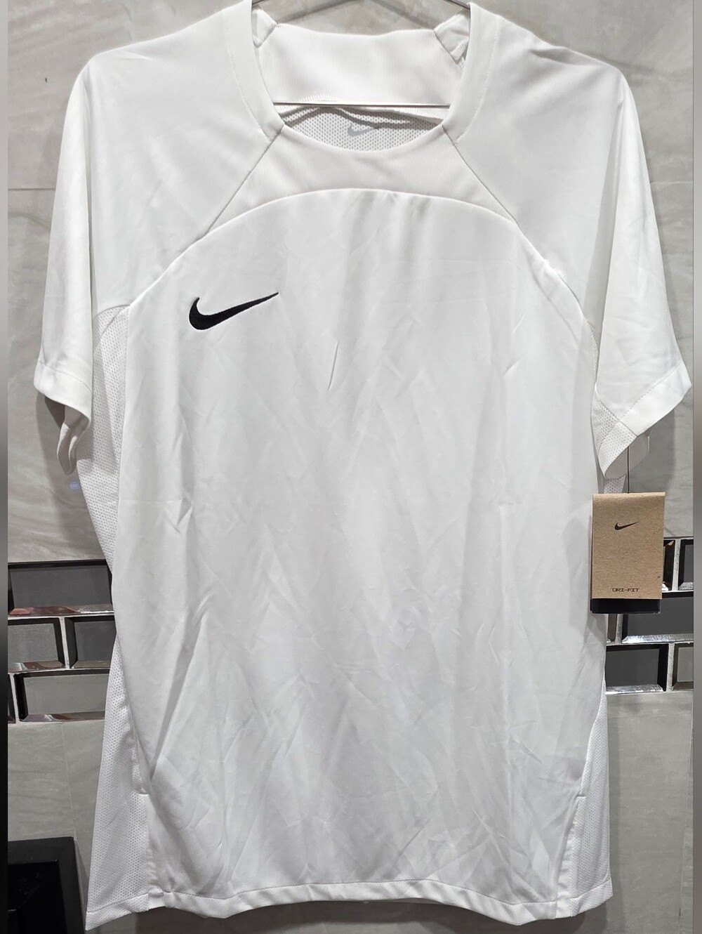 Nike White Short Sleeve Dri-FIT Tee with Black Swoosh